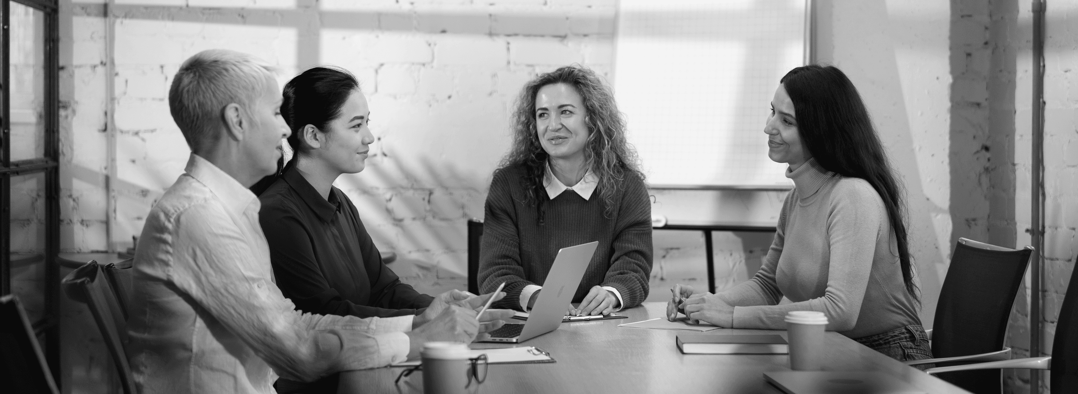 Colleagues collaborating around a conference table